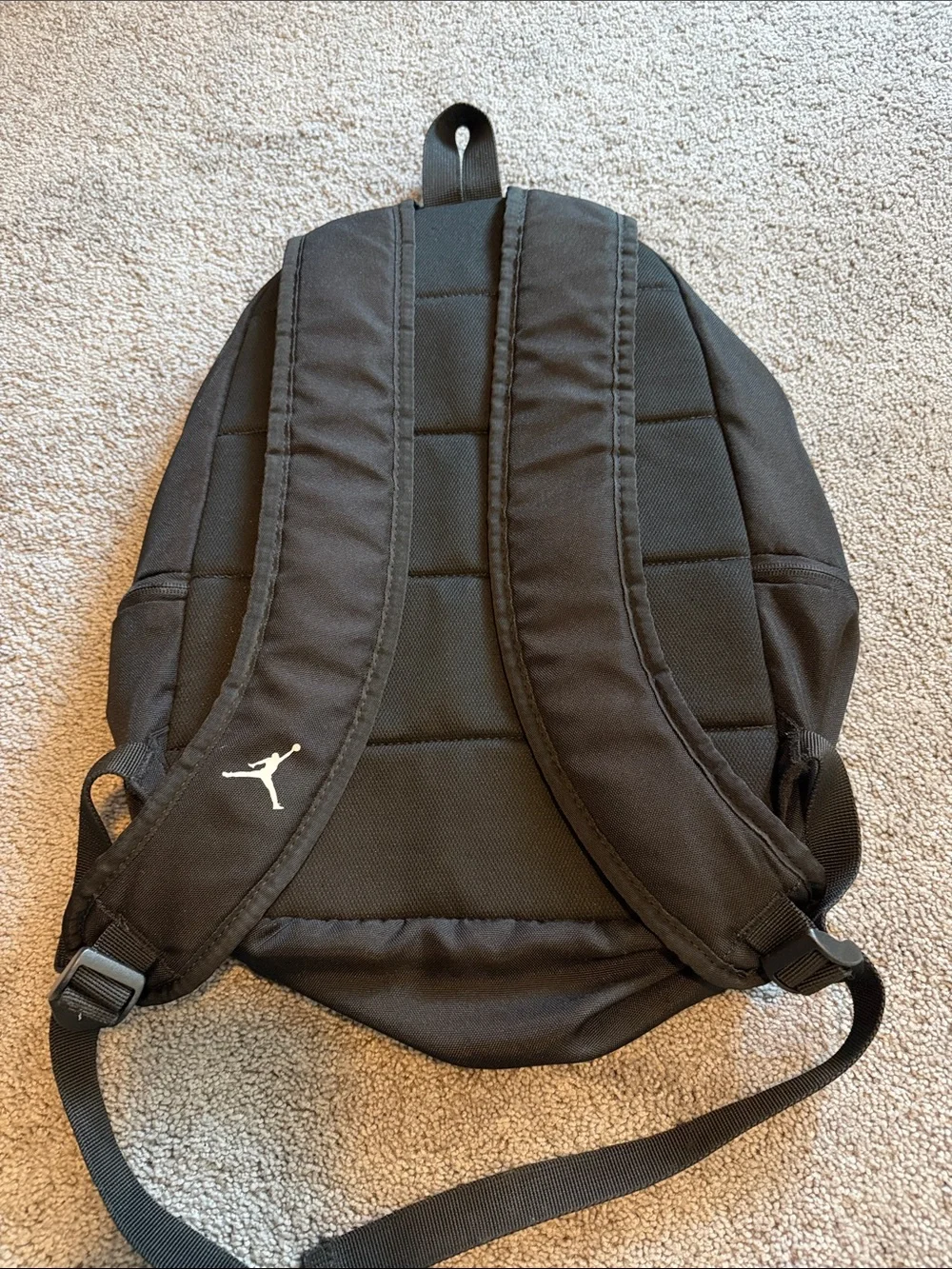 Black Jordan Backpack with Red Jumpman and White Lettering
